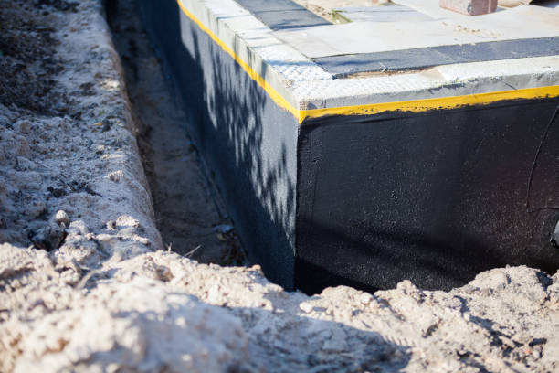 Professional Waterproofing technician working in Minster, OH
